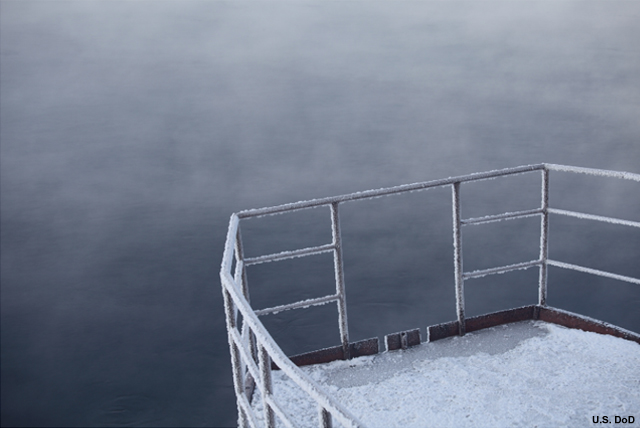 Photograph of a a ship with ice on the deck