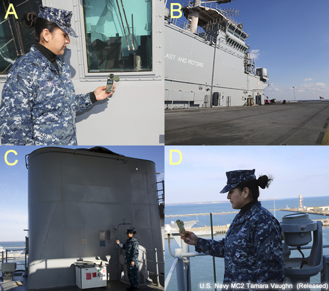 photo of aerographer's mate using an handheld meteorological instrument for measuring temperature.