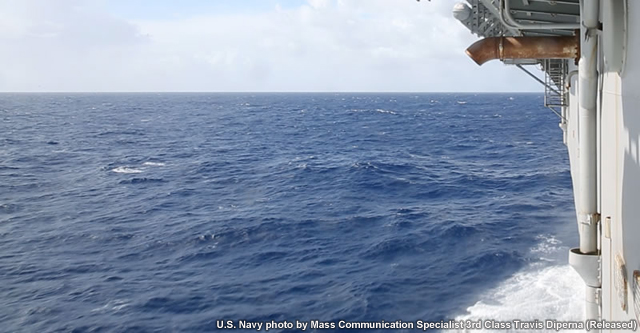photo showing view of sea conditions from a lower-level observation area aboard the Kearsarge